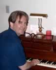 At the piano writing his next big hit! (54,391 bytes)